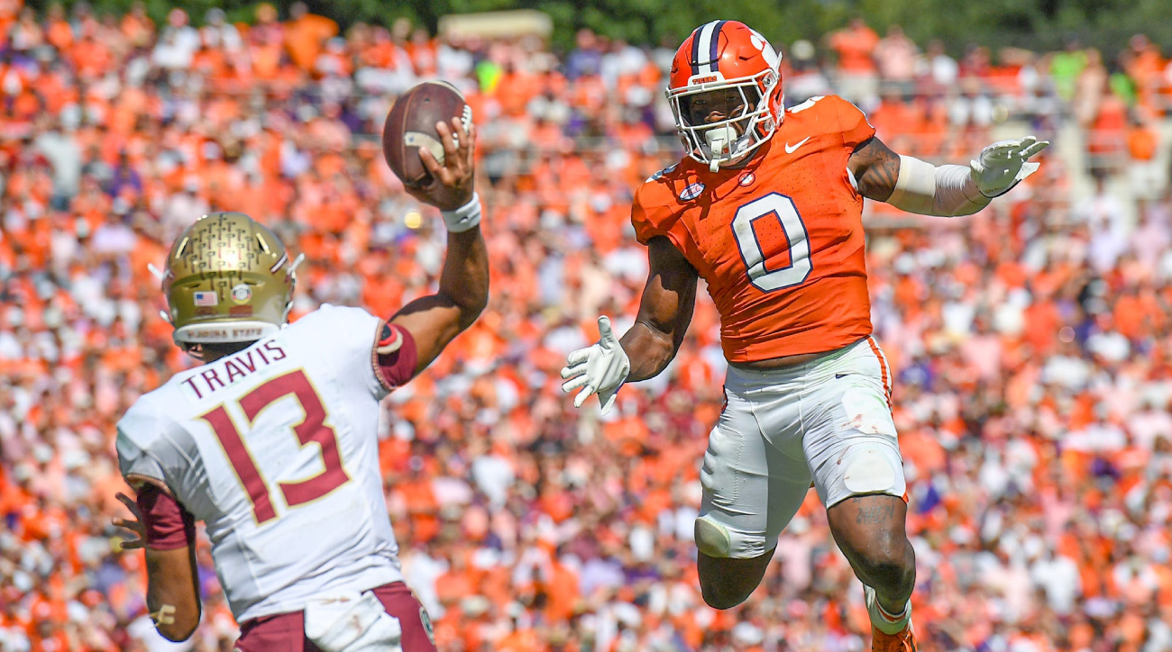 Clemson defender Barrett Carter pressures Florida State quarterback Jordan Travis on a throw.